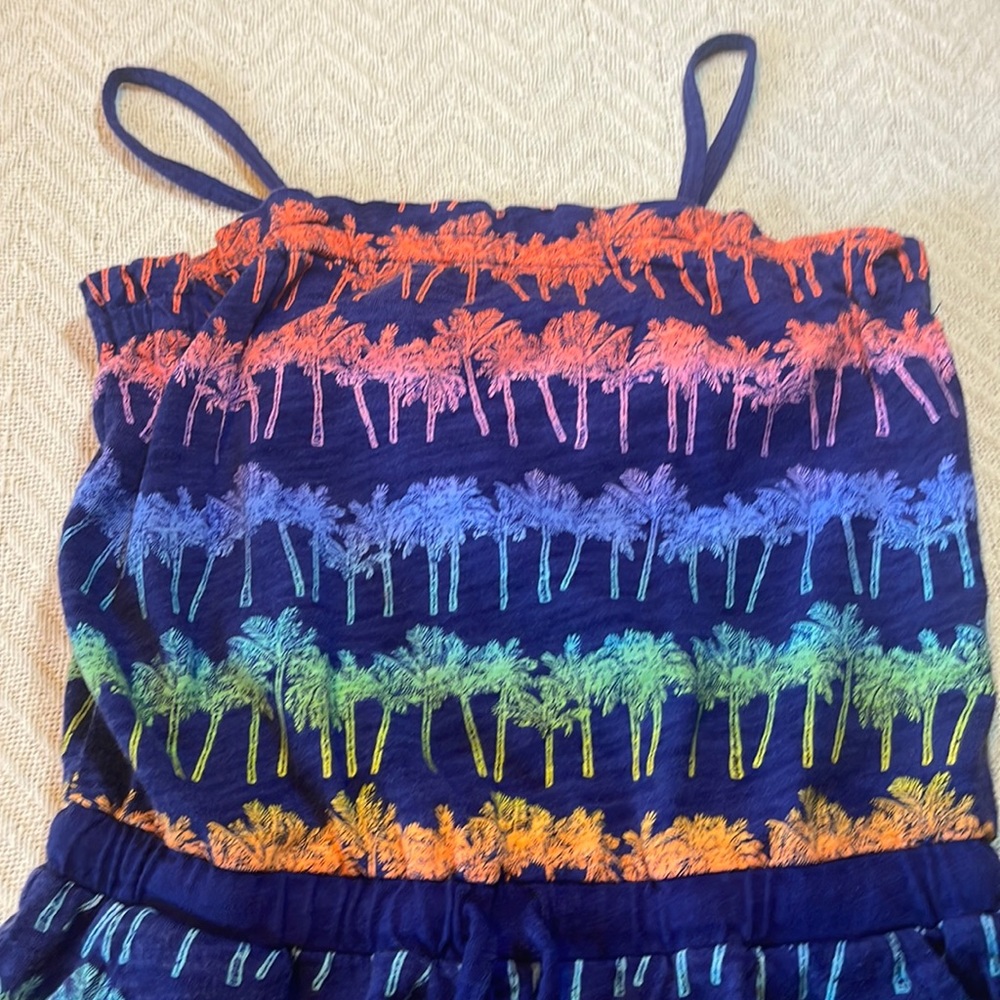 A romper with palm trees
